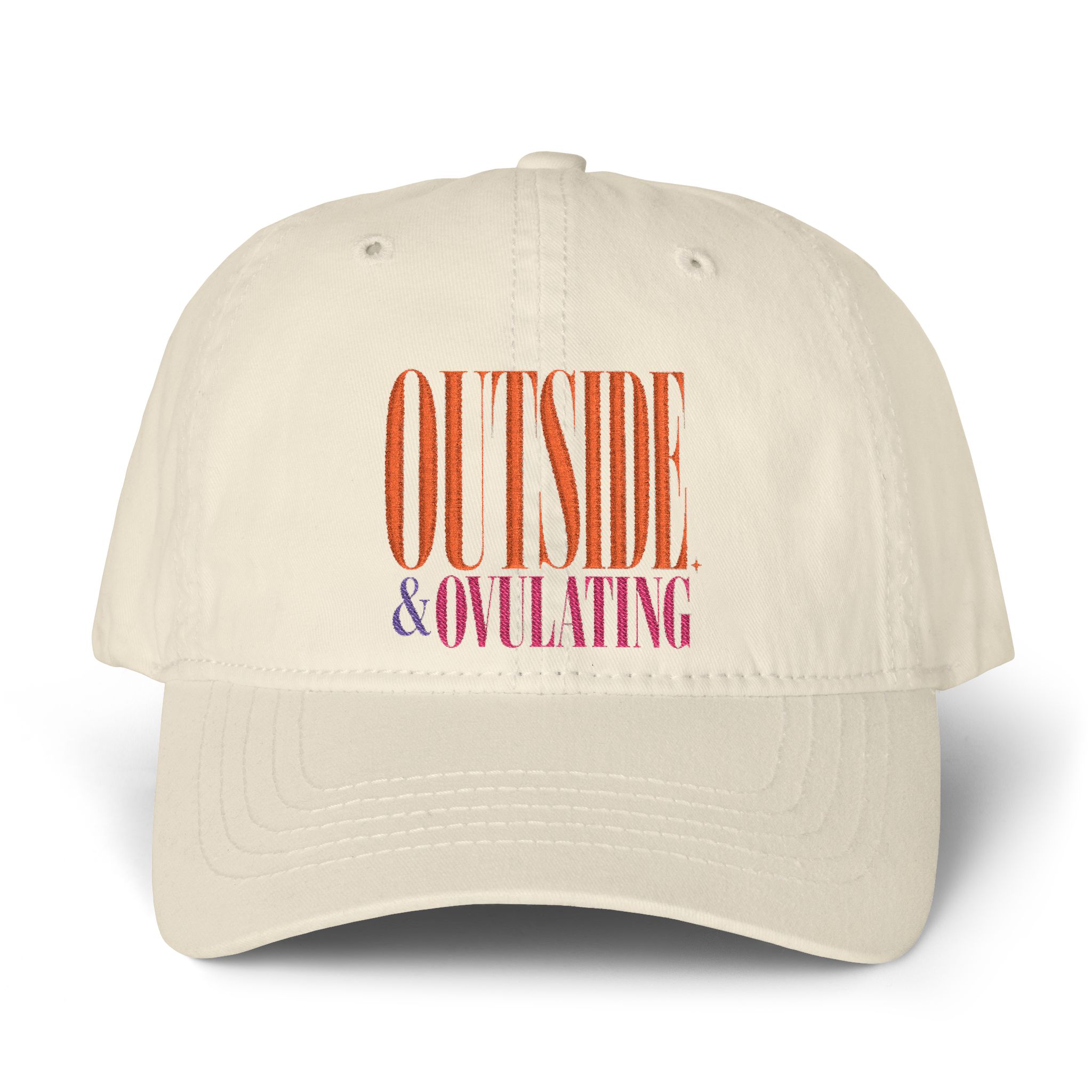 Winter white dad cap with orange and magenta Outside & Ovulating lettering